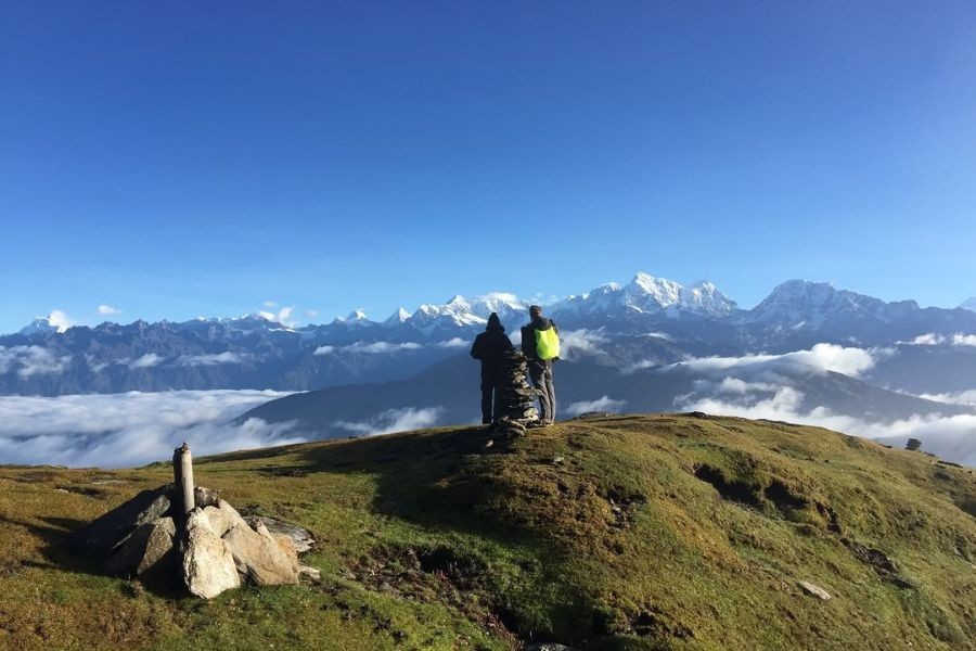 Trekkers enjoying panoramic mountain views on Pikey Peak